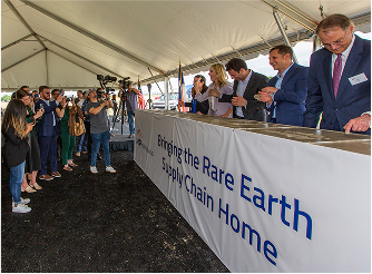 People at Bringing the Rare Earth Supply Chain Home booth